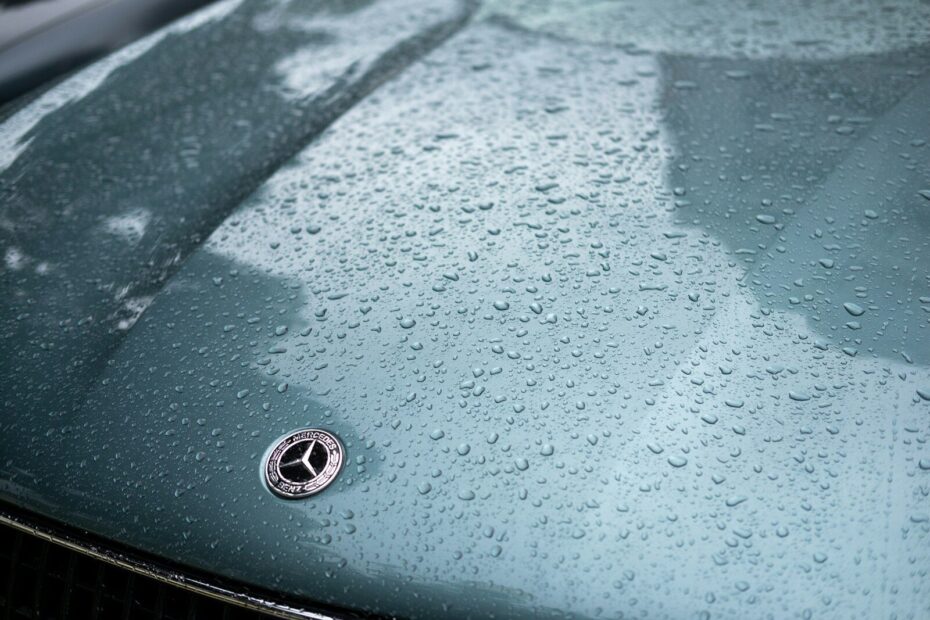 A close up of a car with rain drops on it